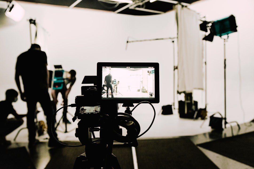 Broadcast media professionals collaborating in a modern studio environment